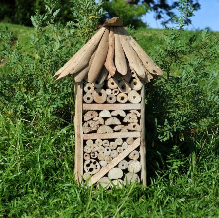 bee hotel and insect boxes made from drift wood