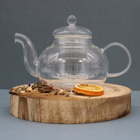 Heat resistant glass teapot with infuser. Stylish modern jug with strainer suitable for herbal tea and coffee.